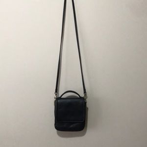 Black leather across the shoulder bag